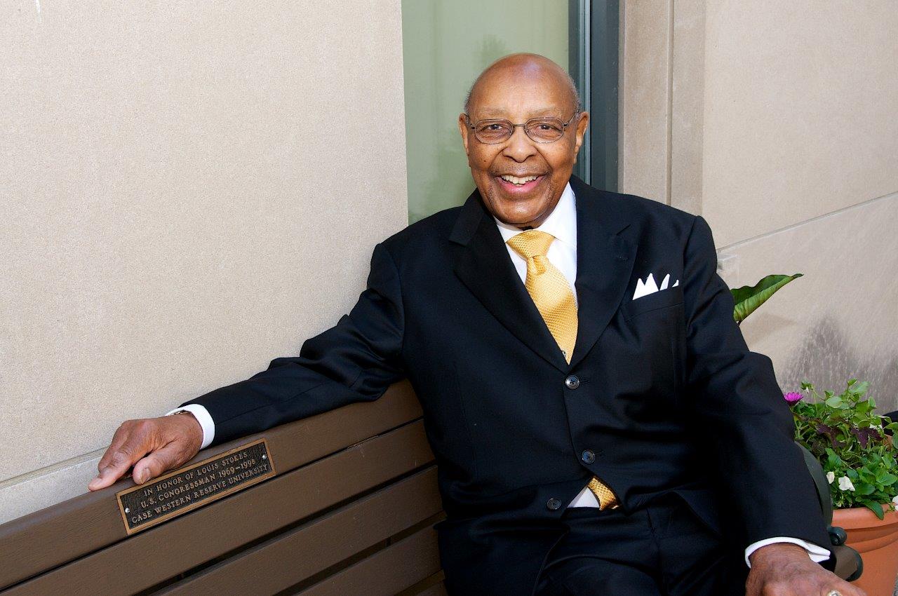 Louis Stokes sitting on a bench
