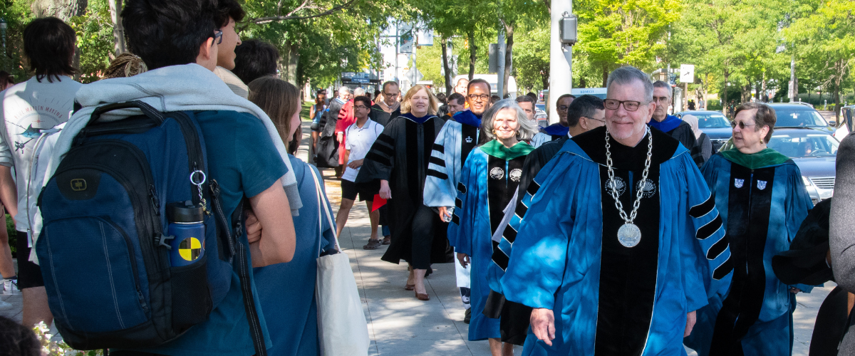 President Kaler walking outside at Convocation