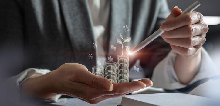 Close up of hands holding money showing growth