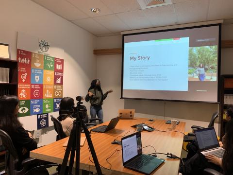 Picture of Asse Emmanuelle Brou presenting her ThinkImpact final project